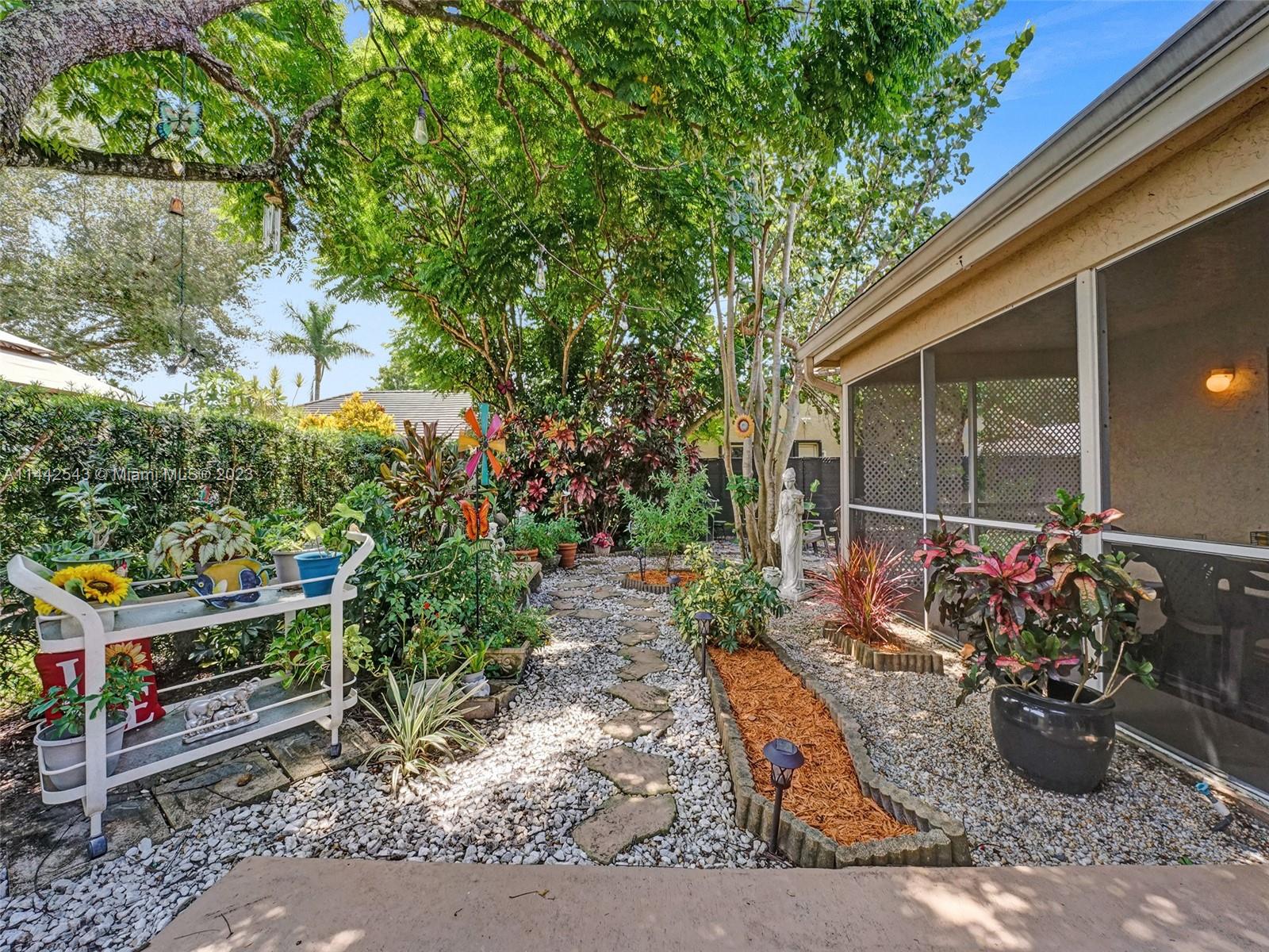 3273 Ridge Trace Davie, FL 33328 - Photo 66 of 74 a wooden bench sitting in front of a building