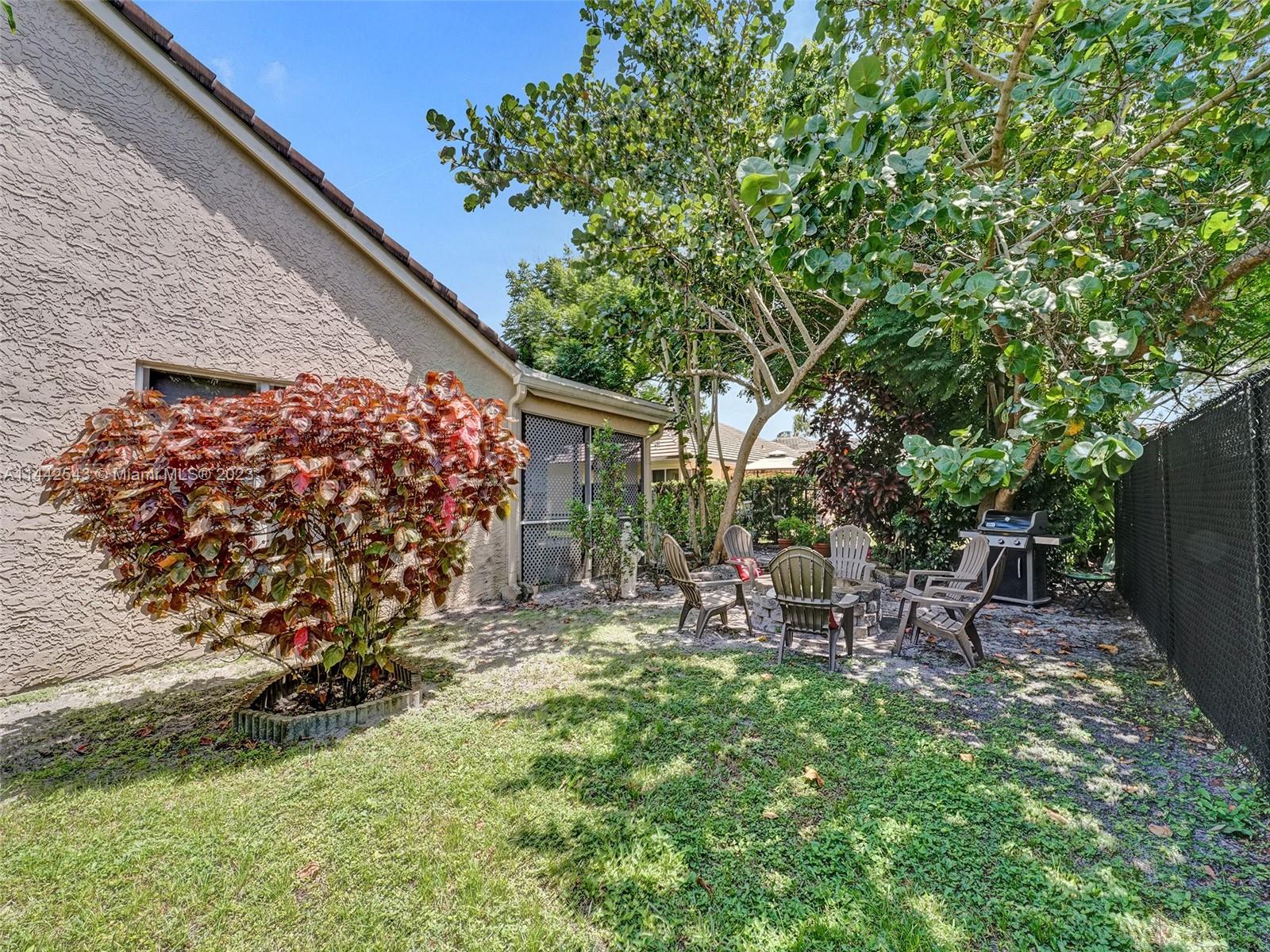 3273 Ridge Trace Davie, FL 33328 - Photo 74 of 74 a view of backyard with outdoor seating and green space