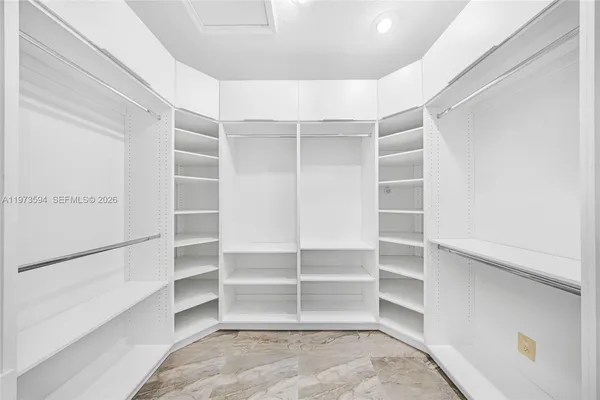 a view of an empty room with empty shelves