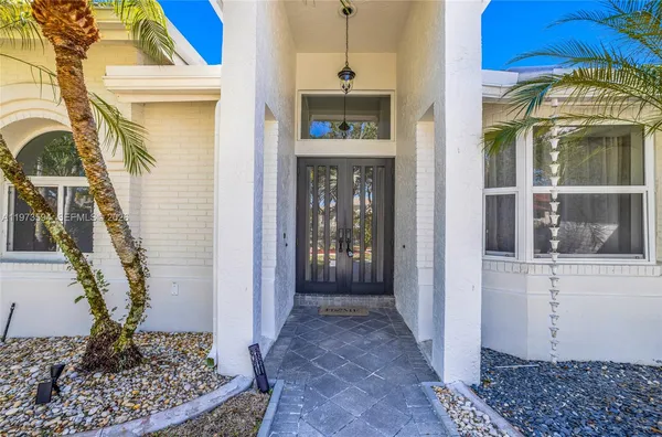 a view of a hallway with entryway of the house
