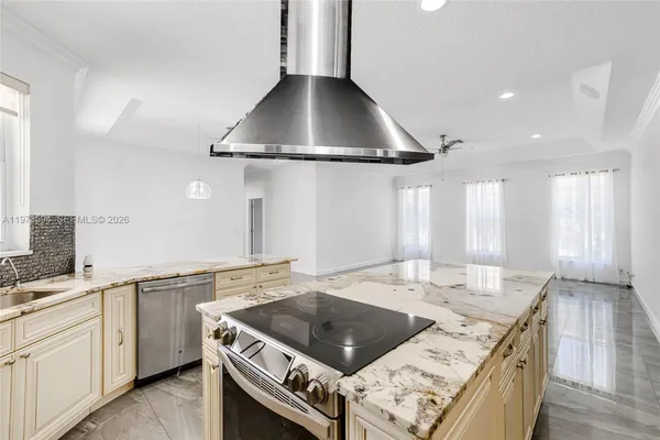 a kitchen with a stove and a sink