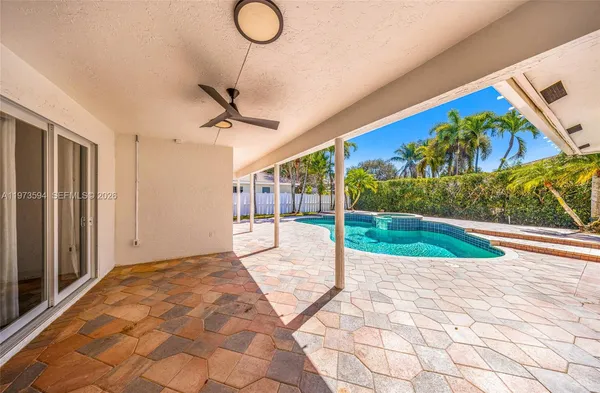 a view of a house with backyard porch and sitting area