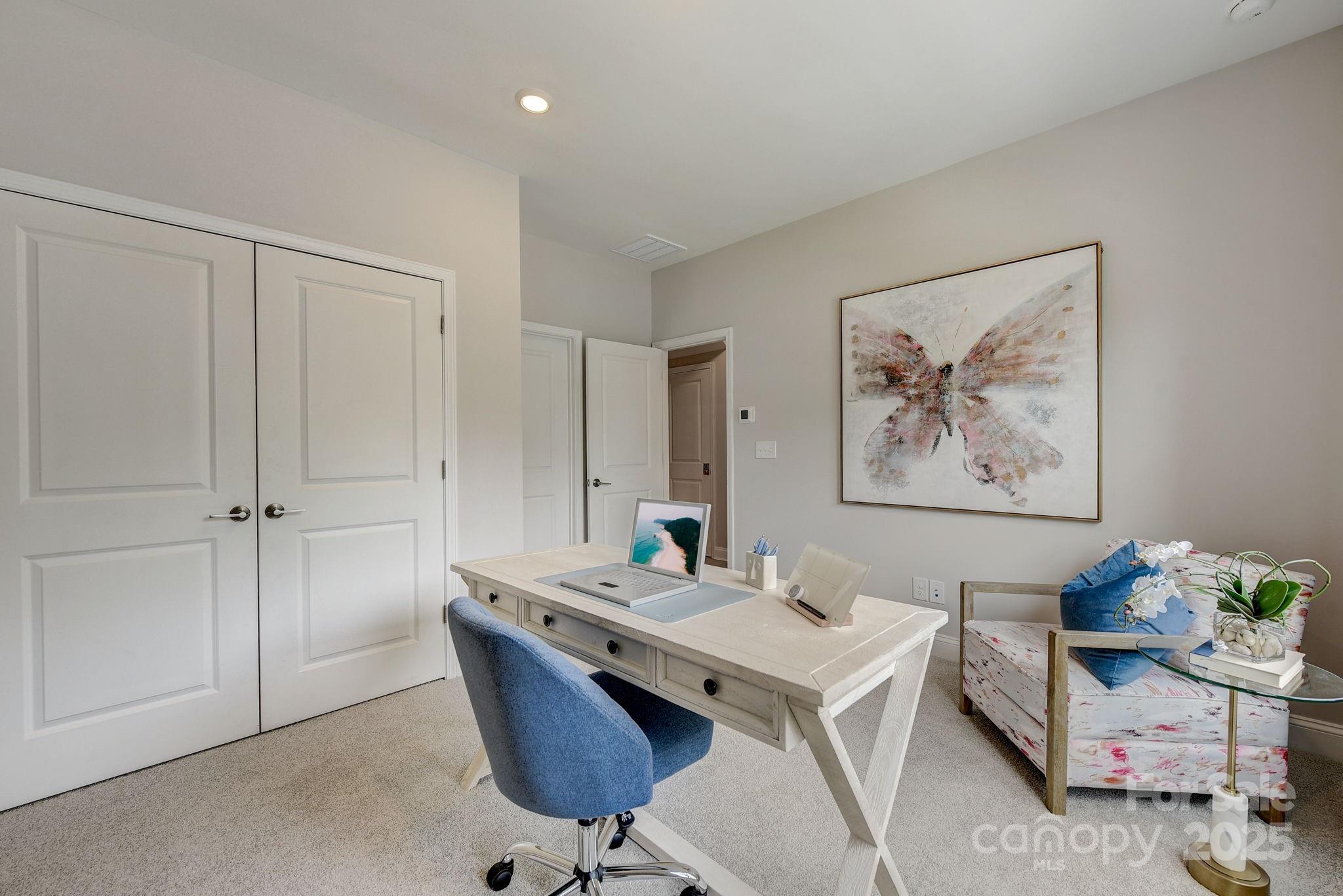 411 Jetton Street Davidson, NC 28036 - Photo 12 of 37 a living room with furniture and a table