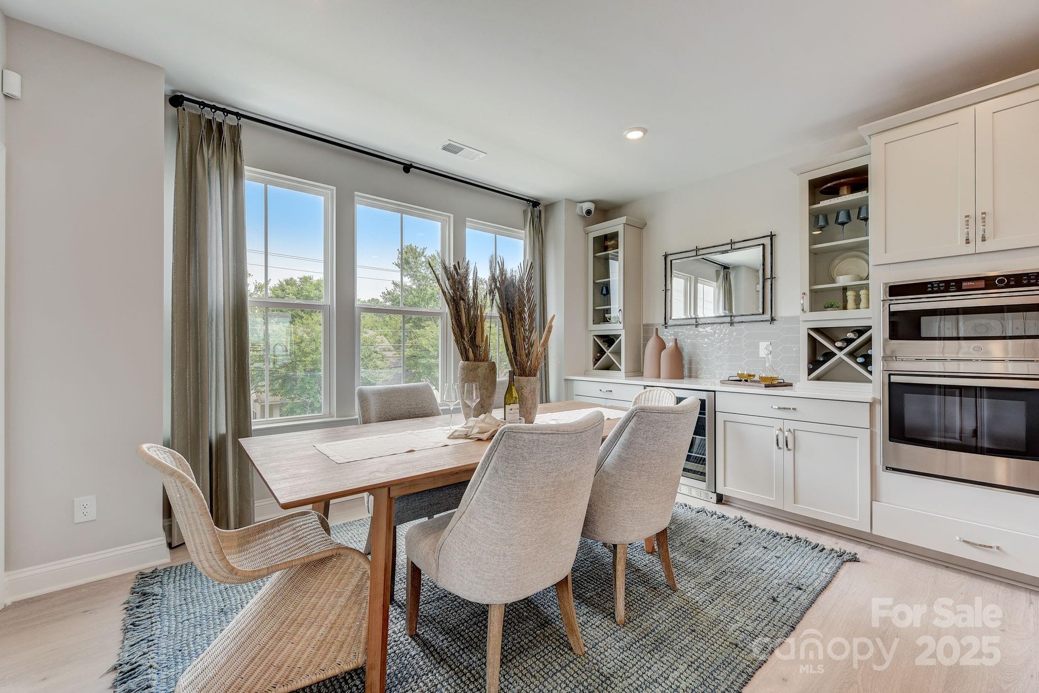 411 Jetton Street Davidson, NC 28036 - Photo 14 of 37 a view of a dining room with furniture window and outside view