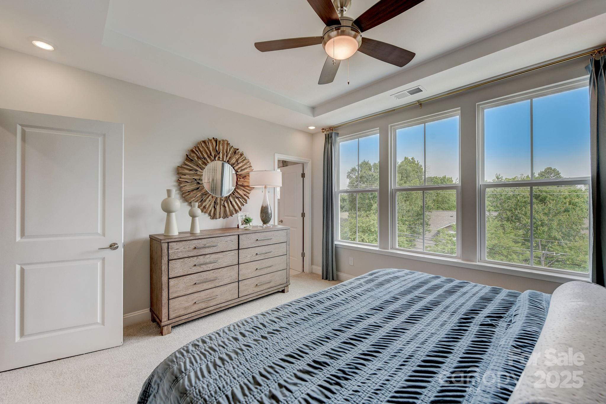 411 Jetton Street Davidson, NC 28036 - Photo 18 of 37 a bedroom with a bed and a window