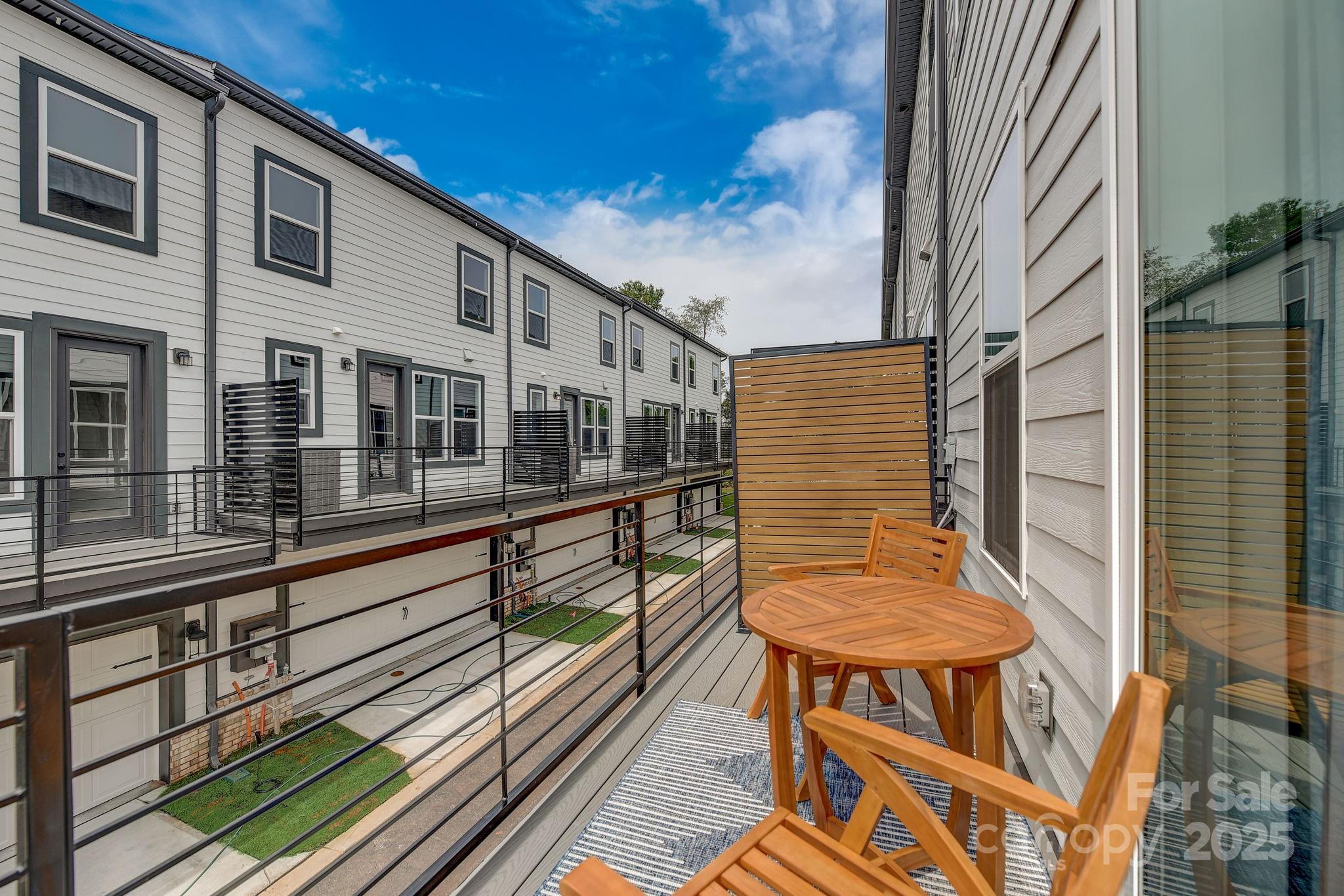 411 Jetton Street Davidson, NC 28036 - Photo 26 of 37 a view of a balcony with chairs