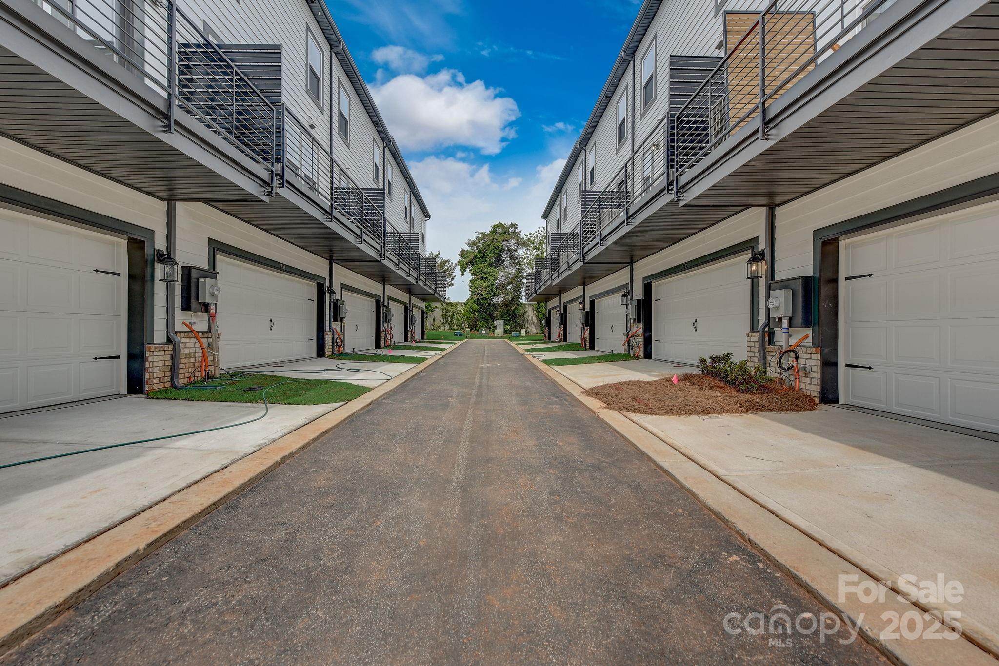 411 Jetton Street Davidson, NC 28036 - Photo 28 of 37 a view of a house with a backyard