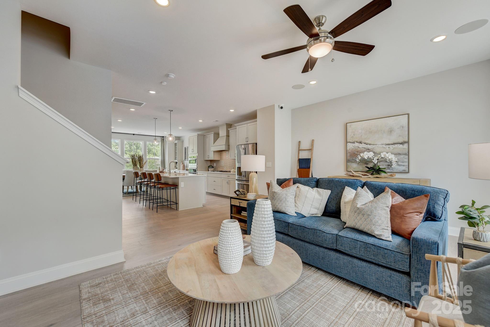 411 Jetton Street Davidson, NC 28036 - Photo 9 of 37 a living room with furniture and a table