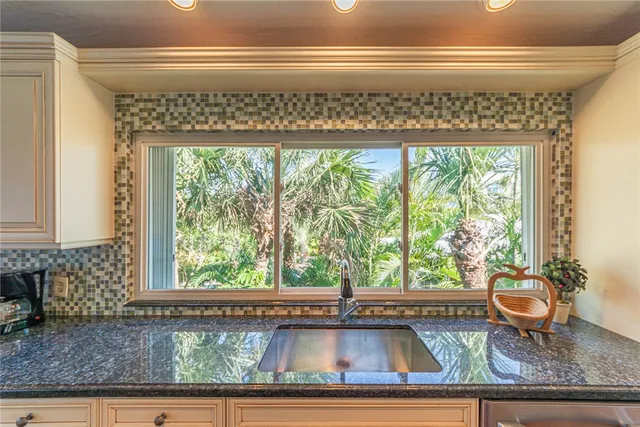 a view of living room with a furniture and floor to ceiling window