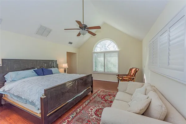 a bed room with a bed and a chandelier