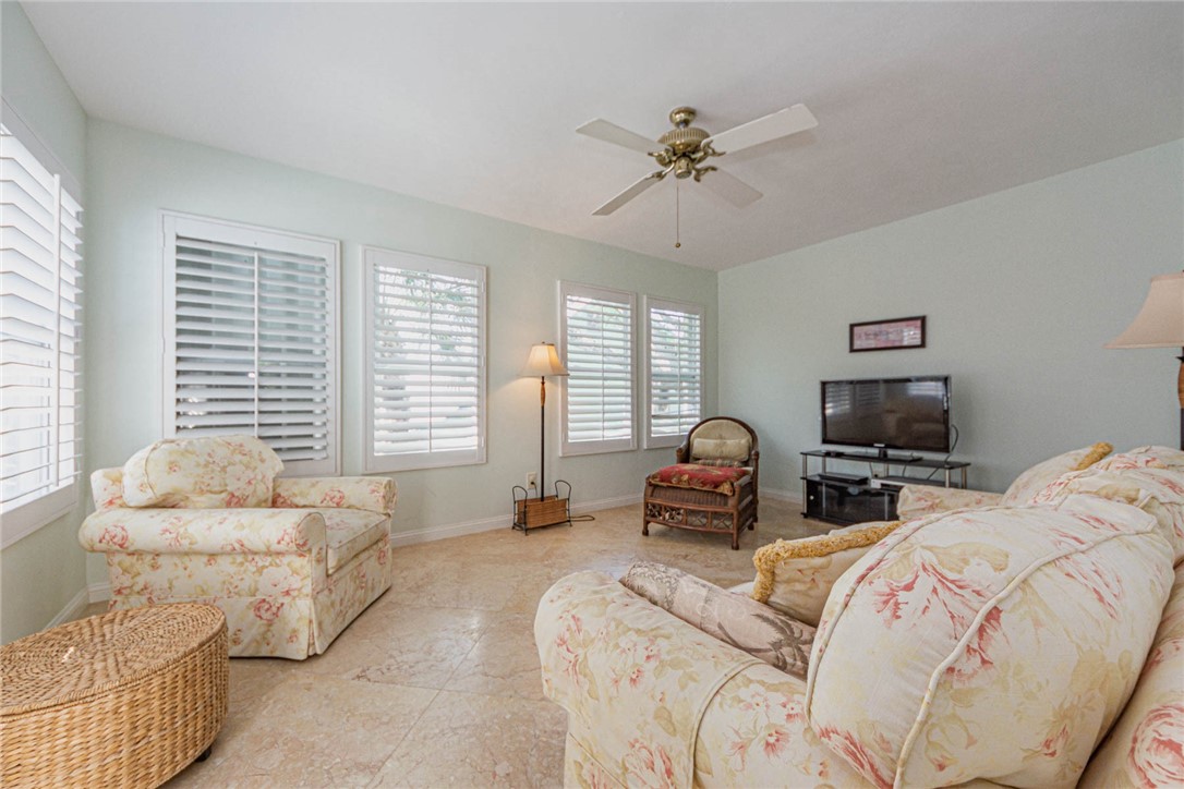 1850 East Sandpiper Road Vero Beach, FL 32963 - Photo 22 of 36 a bed room with bed and a couch