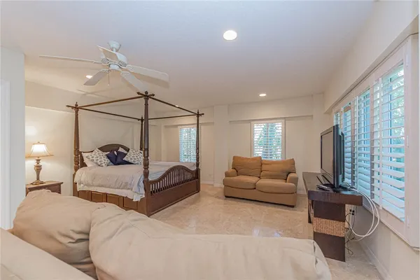a living room with furniture a couch and a chandelier