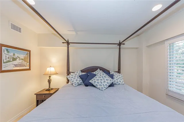 a bed room with a bed and a window