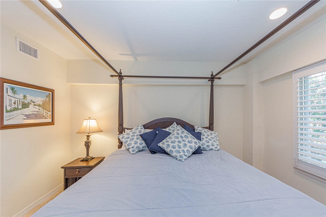 1850 East Sandpiper Road Vero Beach, FL 32963 - Photo 28 of 36 a bed room with a bed and a window