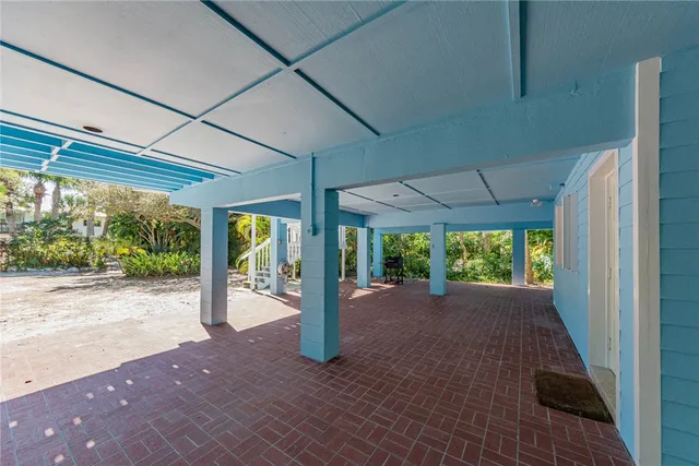 a view of a porch with wooden floor and outdoor space