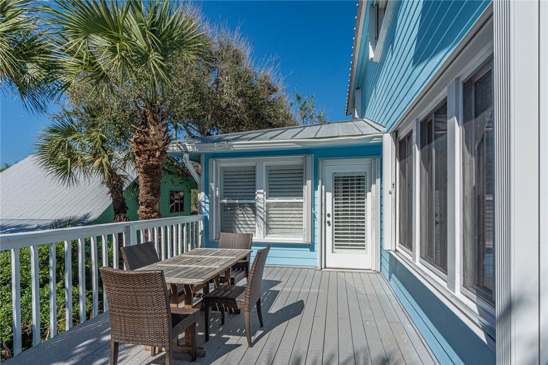 1850 East Sandpiper Road Vero Beach, FL 32963 - Photo 5 of 36 a view of a wooden chairs and table on the deck