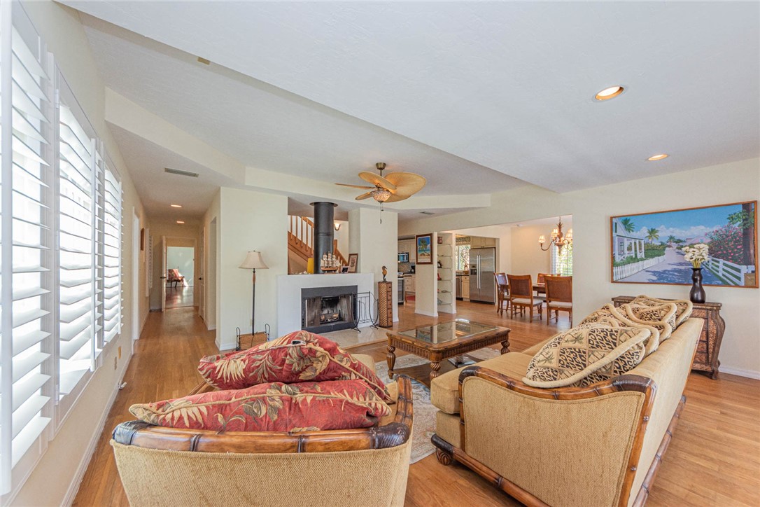 1850 East Sandpiper Road Vero Beach, FL 32963 - Photo 8 of 36 a living room with furniture fireplace and large windows