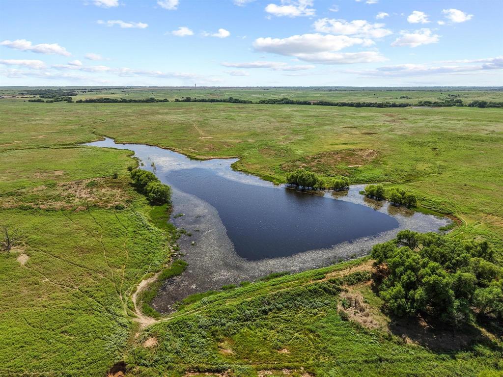 32 State Highway 32 Ryan, OK 73565 - Photo 16 of 40 a view of a lake with a yard