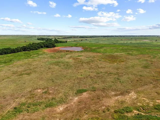 a view of a big yard with an outdoor space and seating space