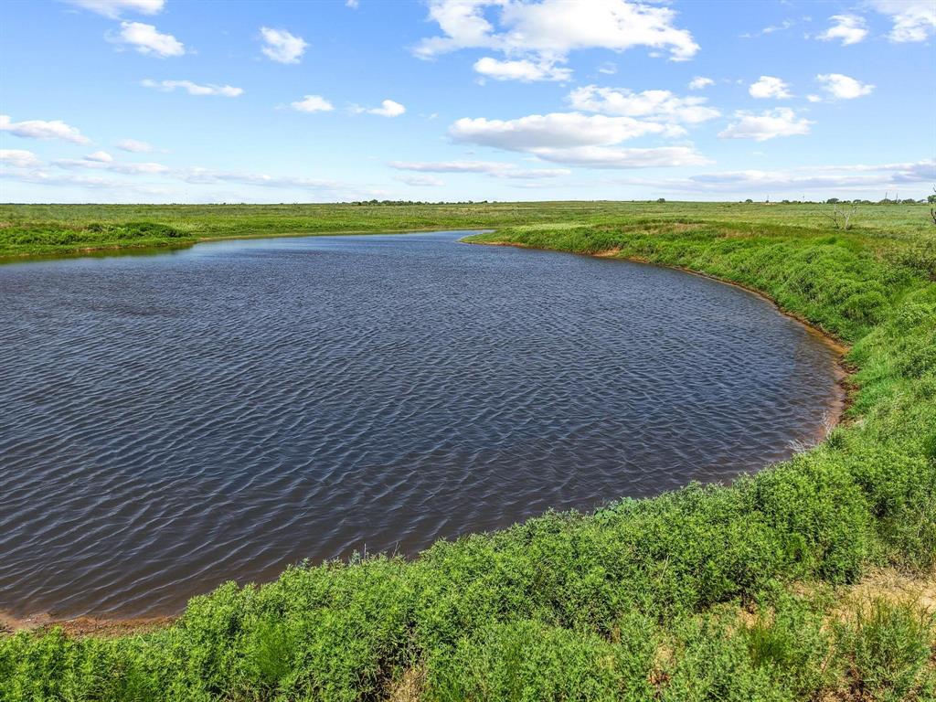 32 State Highway 32 Ryan, OK 73565 - Photo 39 of 40 a view of a golf course with a lake