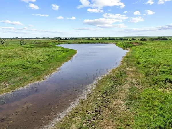 a view of a lake with a big yard