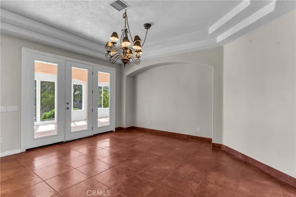 a kitchen with stainless steel appliances granite countertop a sink a stove a refrigerator and cabinets