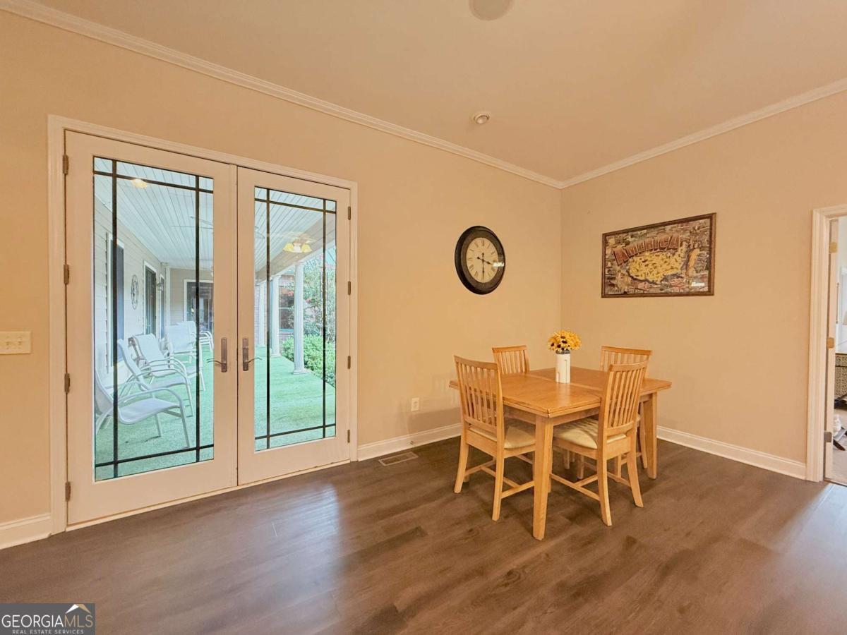 2415 Elko Road Elko, GA 31025 - Photo 18 of 85 a view of a dining room with furniture and wooden floor