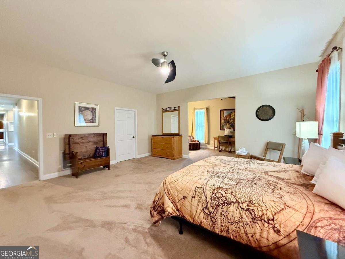 2415 Elko Road Elko, GA 31025 - Photo 24 of 85 a bedroom with a bed and furniture