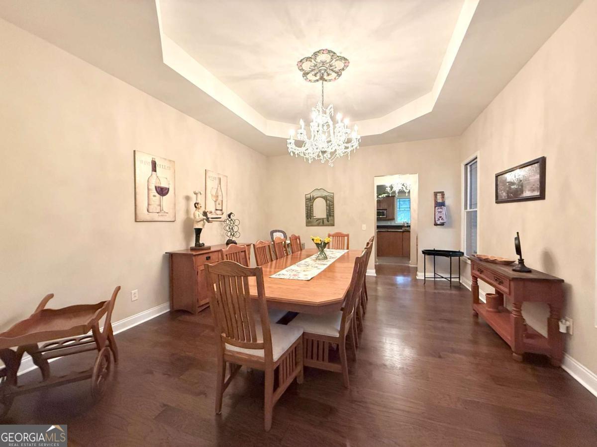 2415 Elko Road Elko, GA 31025 - Photo 4 of 85 a view of a dining room with furniture and wooden floor