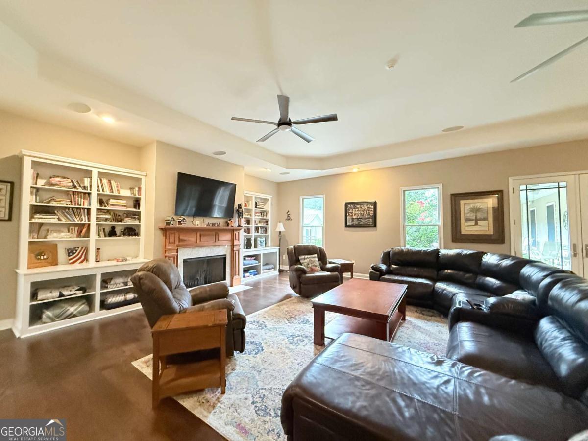 2415 Elko Road Elko, GA 31025 - Photo 43 of 85 a living room with furniture fireplace and a flat screen tv