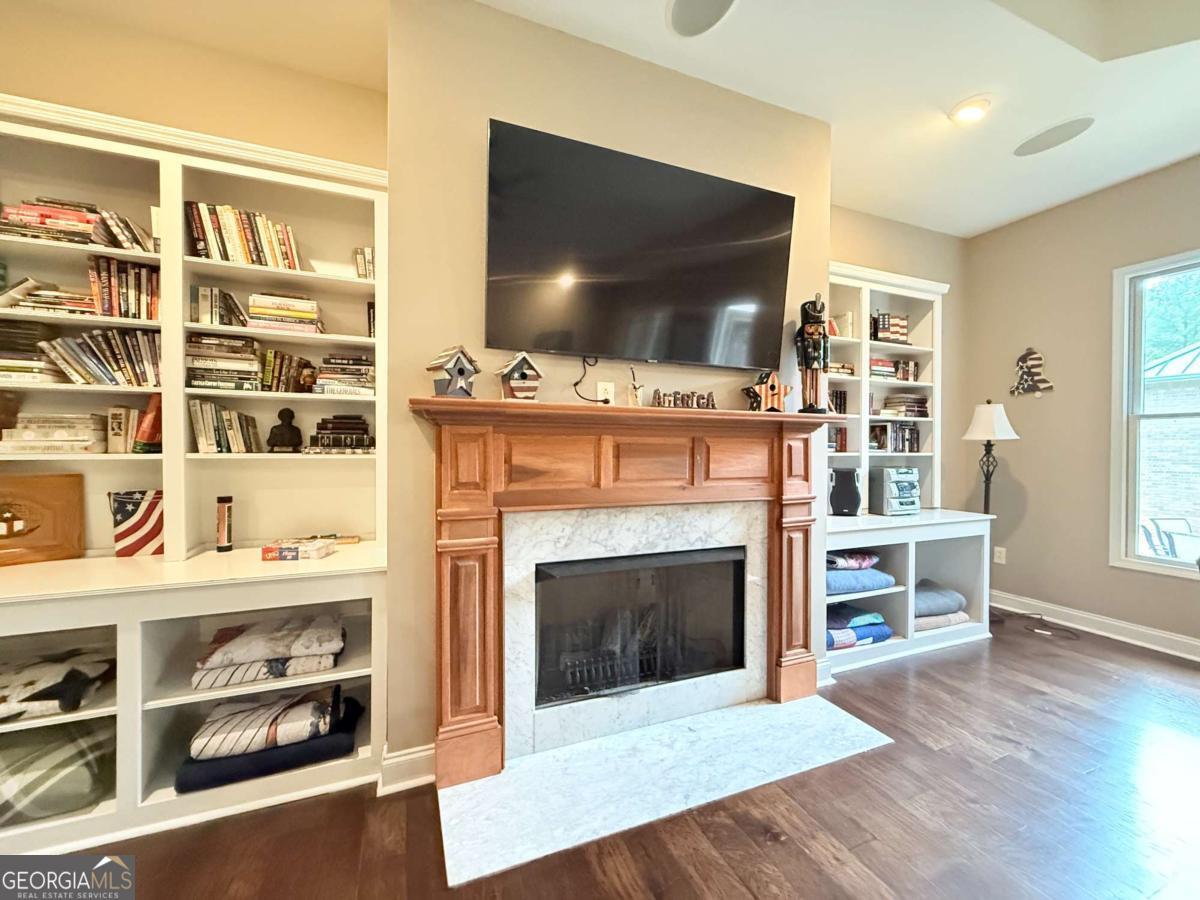 2415 Elko Road Elko, GA 31025 - Photo 44 of 85 a living room with a flat screen tv and a fireplace
