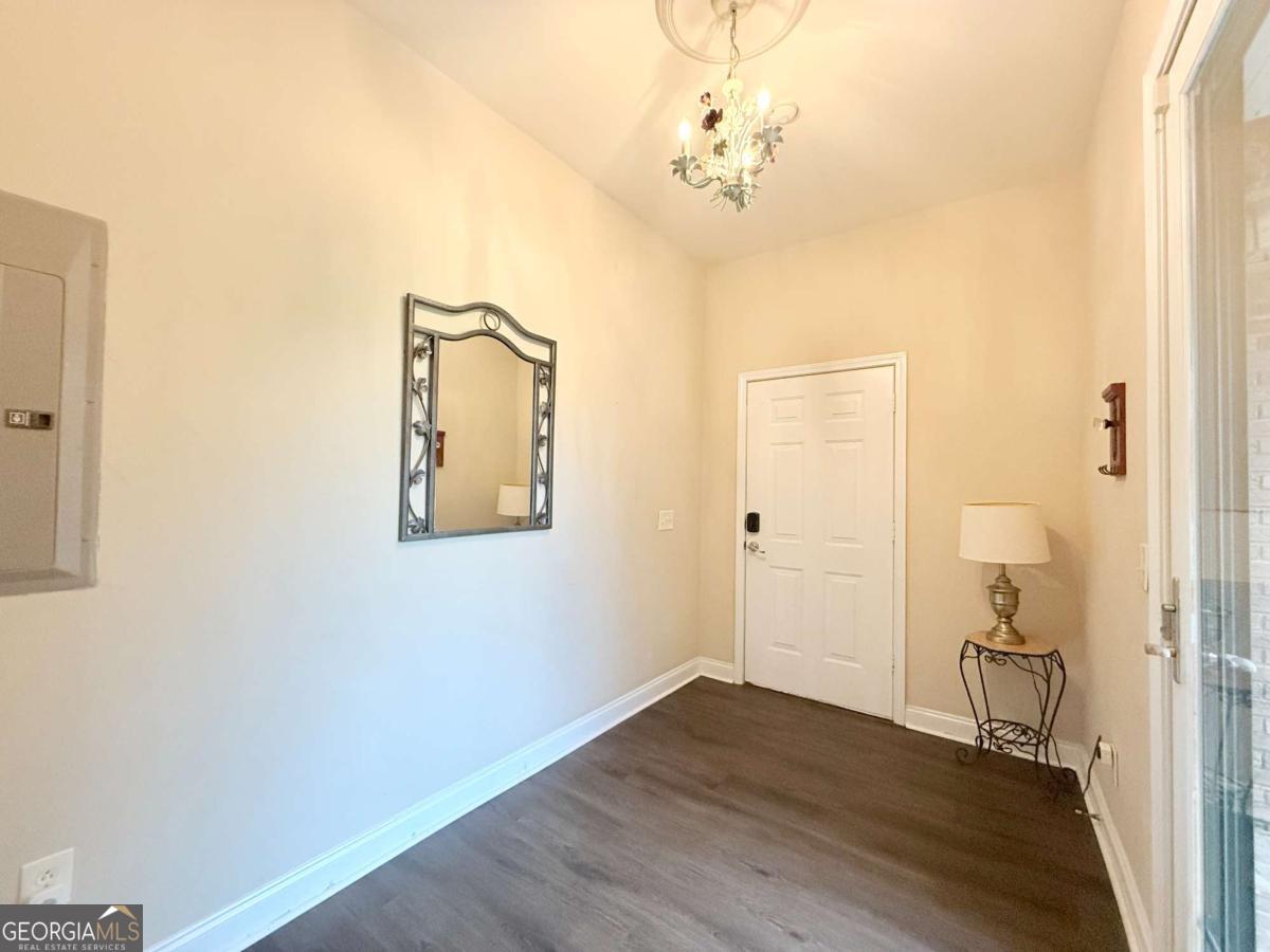 2415 Elko Road Elko, GA 31025 - Photo 56 of 85 a view of a hallway with wooden floor and a bathroom