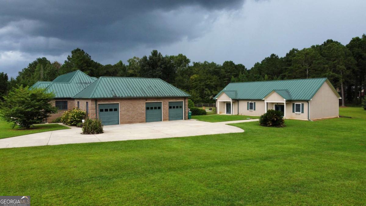 2415 Elko Road Elko, GA 31025 - Photo 74 of 85 a front view of a house with a yard