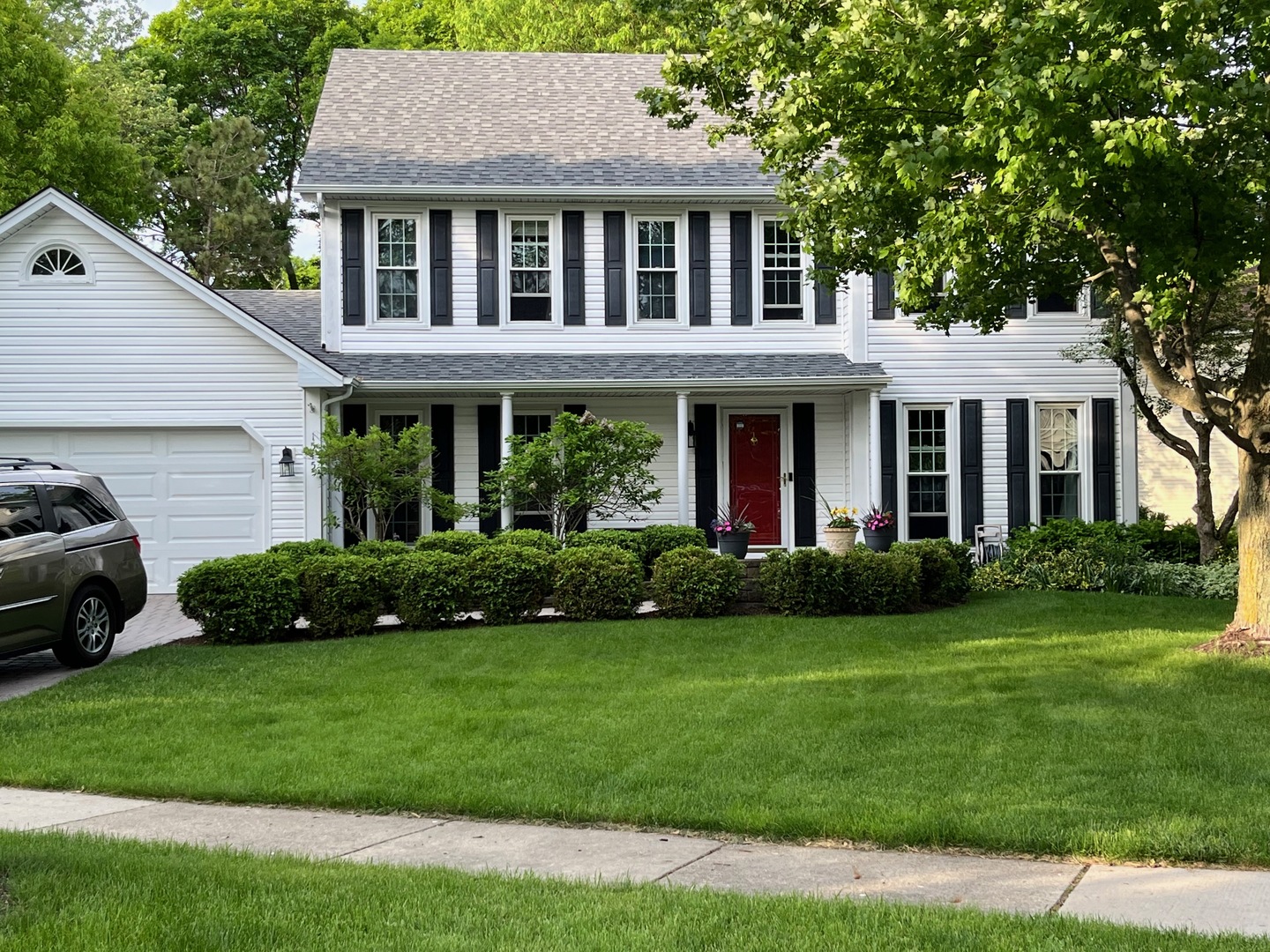 1545 Preston Road Naperville, IL 60563 - Photo 1 of 38 a front view of a house with a yard and garage