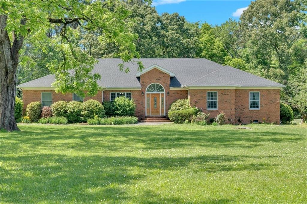 860 Lovebridge Road Southeast Calhoun, GA 30701 - Photo 1 of 1 a front view of a house with a yard