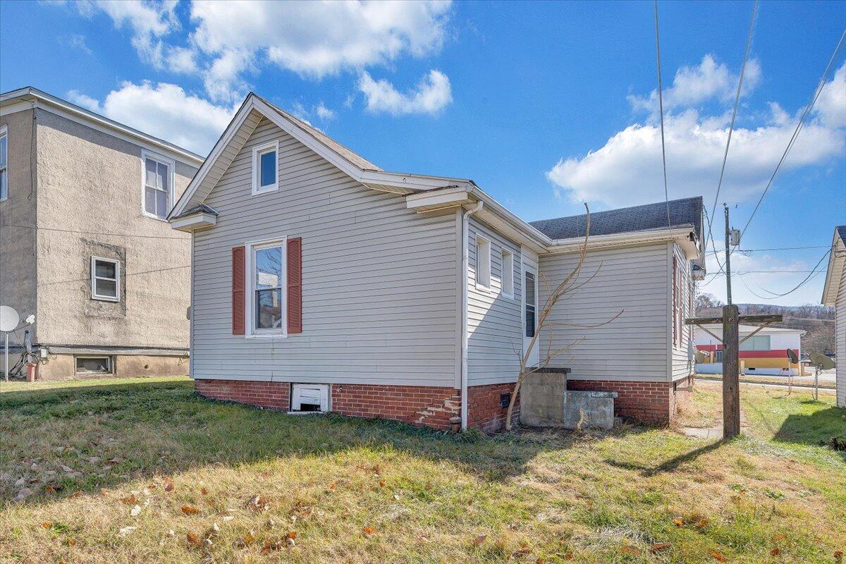 228 East Beech Street Covington, VA 24426 - Photo 24 of 28 a view of a house with a yard