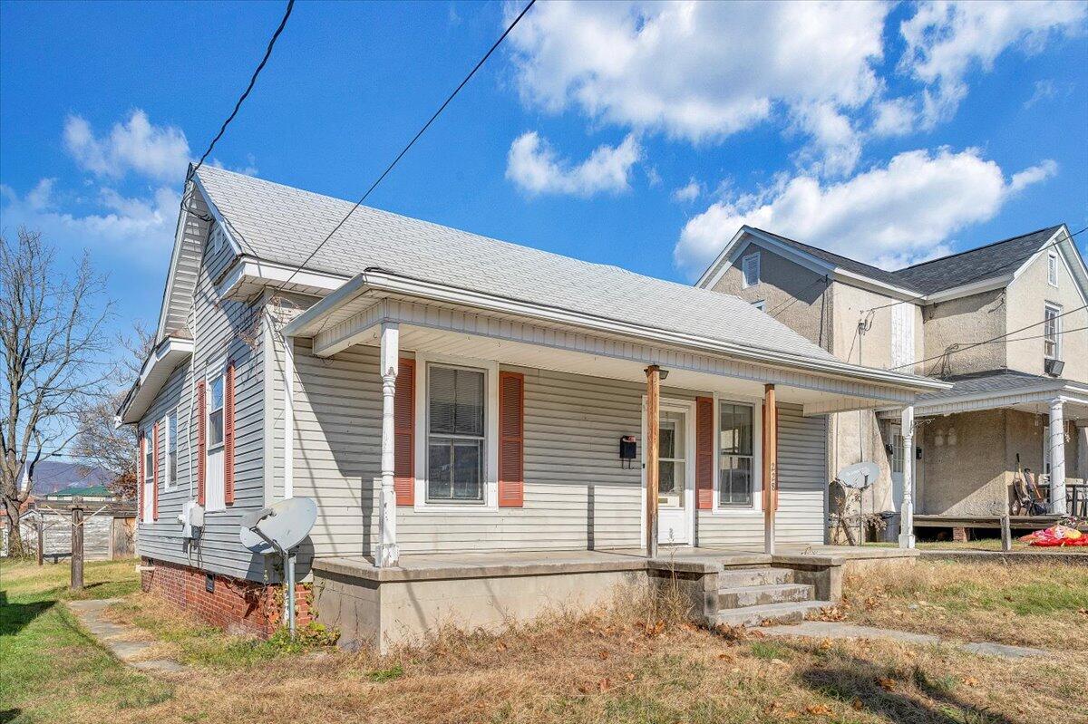 228 East Beech Street Covington, VA 24426 - Photo 26 of 28 front view of a house with a patio