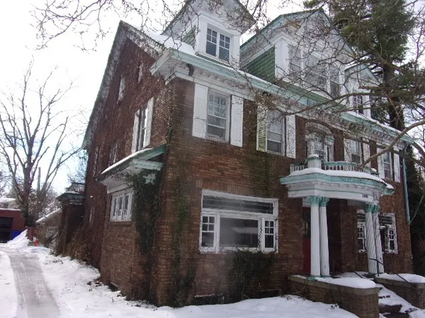 a front view of a building with a lot of windows
