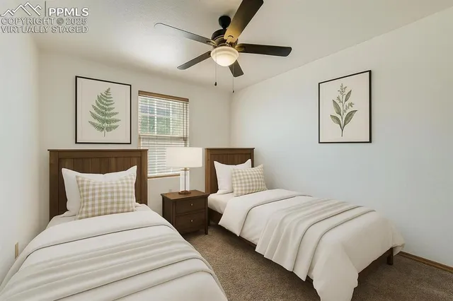 a view of a livingroom with a chandelier fan