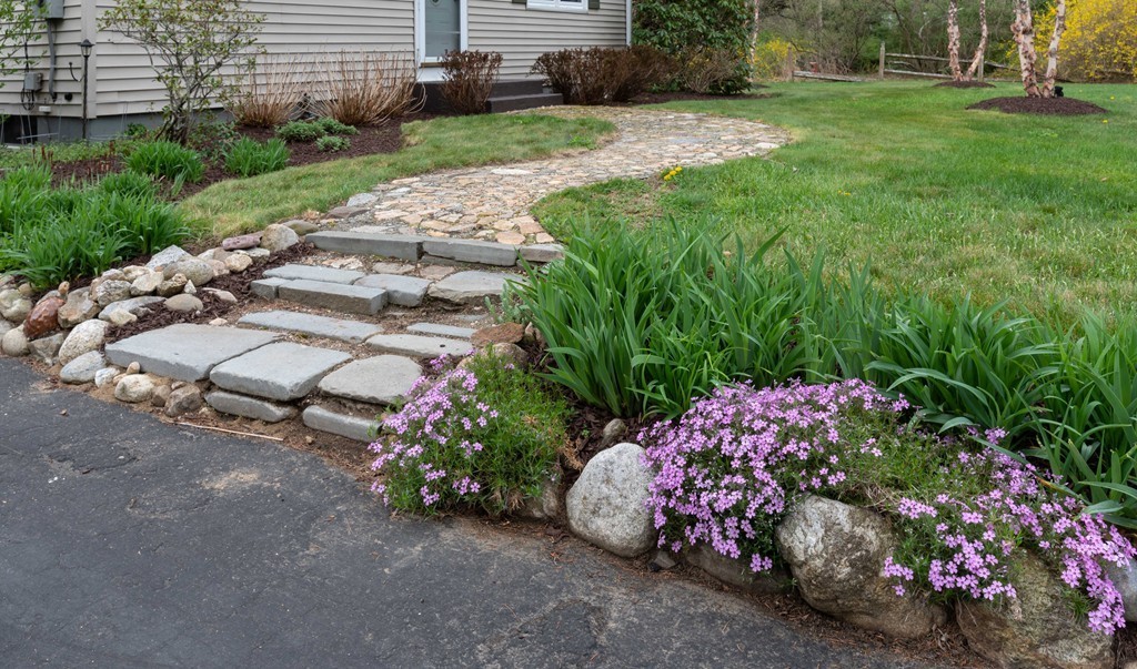 960 Westhampton Road Northampton, MA 01062 - Photo 2 of 16 a garden with flowers and garden