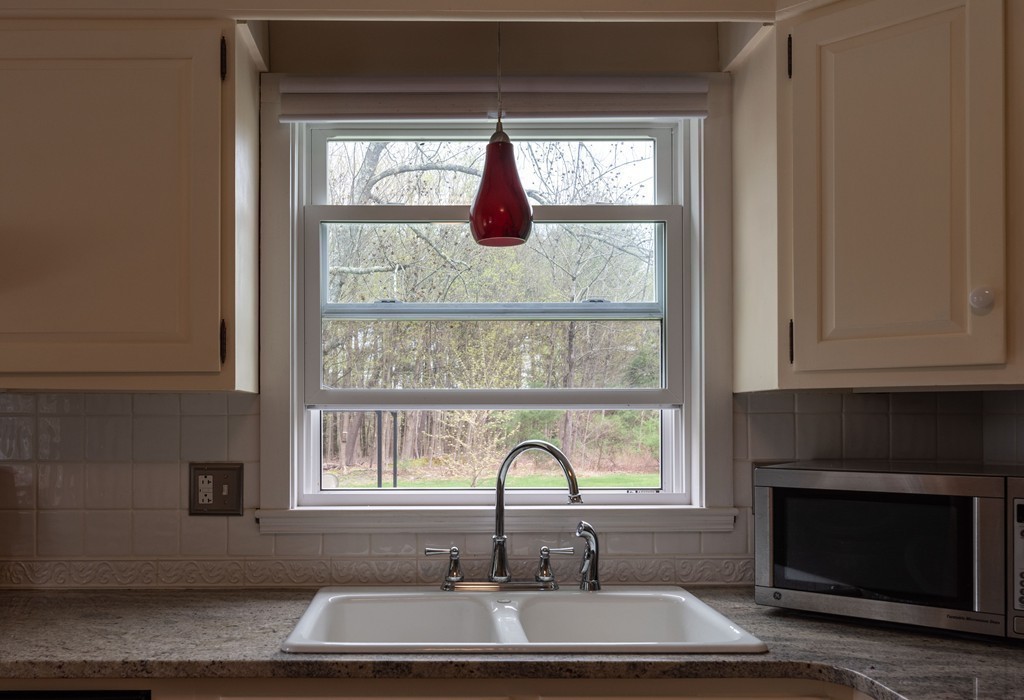 960 Westhampton Road Northampton, MA 01062 - Photo 5 of 16 a bathroom with a sink and a window