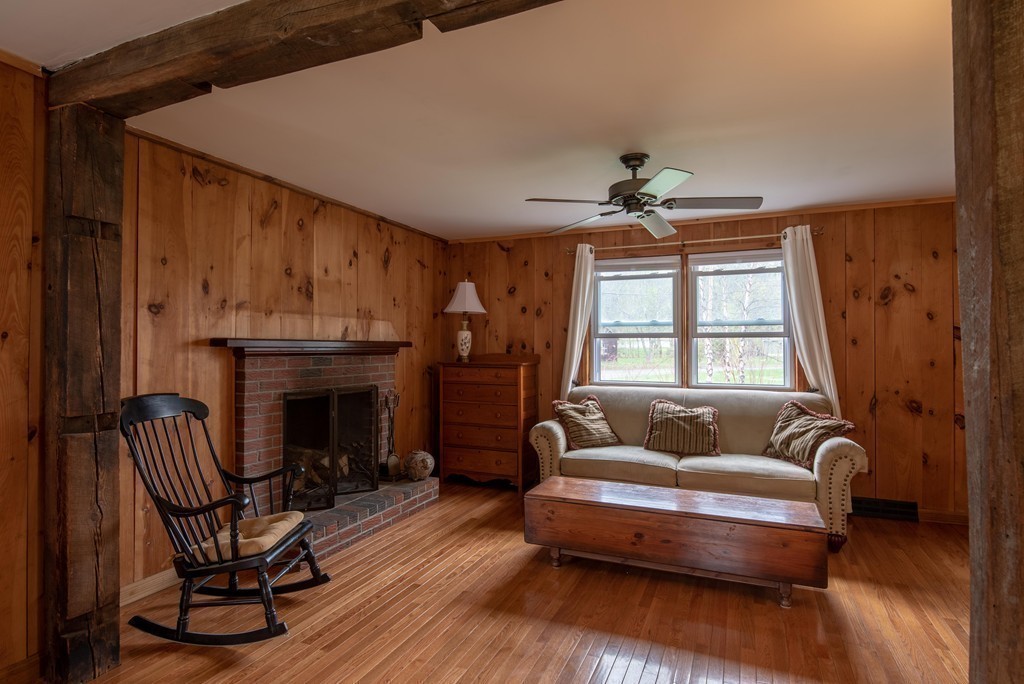 960 Westhampton Road Northampton, MA 01062 - Photo 6 of 16 a living room with furniture and a fireplace