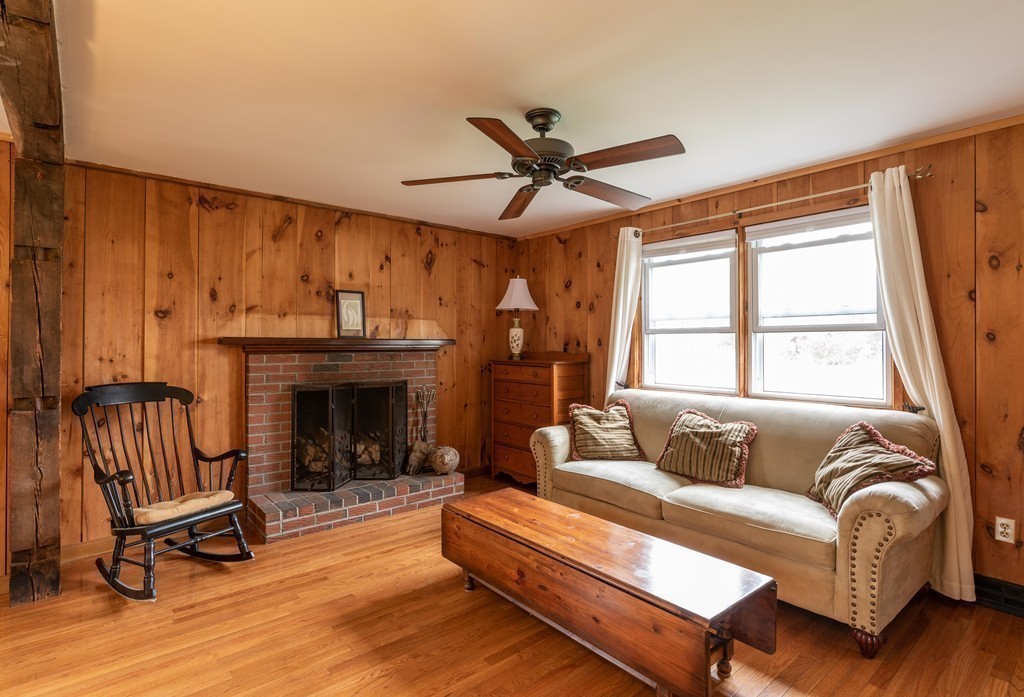 960 Westhampton Road Northampton, MA 01062 - Photo 7 of 16 a living room with furniture and a fireplace