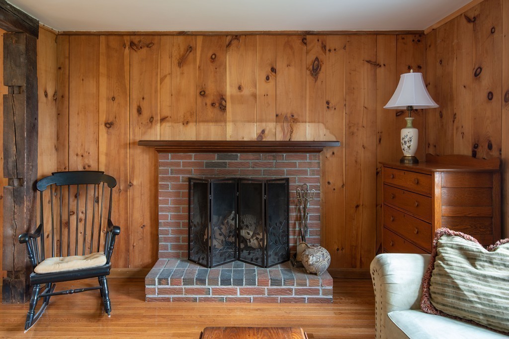 960 Westhampton Road Northampton, MA 01062 - Photo 8 of 16 a living room with furniture and a fireplace