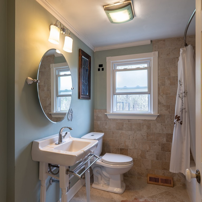 960 Westhampton Road Northampton, MA 01062 - Photo 10 of 16 a bathroom with a toilet a sink and mirror