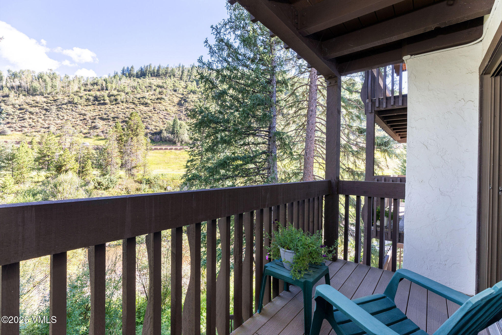 4600 Vail Racquet Club Drive, Unit 610 Vail, CO 81657 - Photo 12 of 26 a view of a chairs and table in the balcony