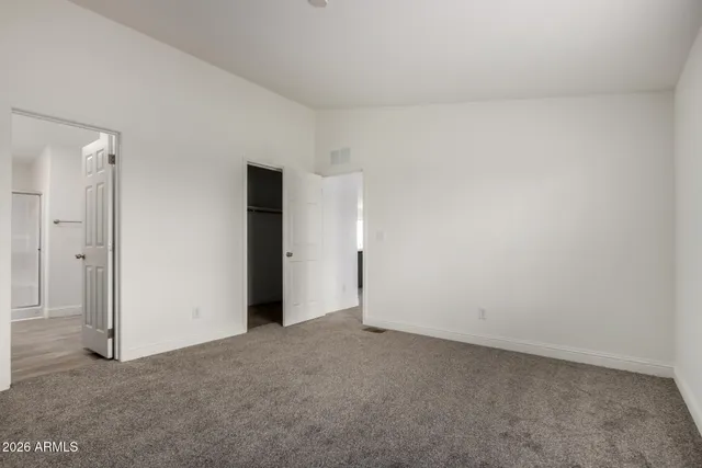 a view of an empty room and a windows