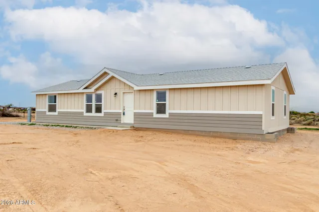 a bathroom with a granite countertop sink and a vanity