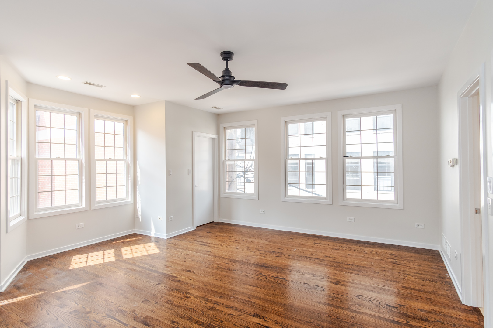 24 North Ada Street, Unit I Chicago, IL 60607 - Photo 14 of 29 a view of an empty room with wooden floor and a window