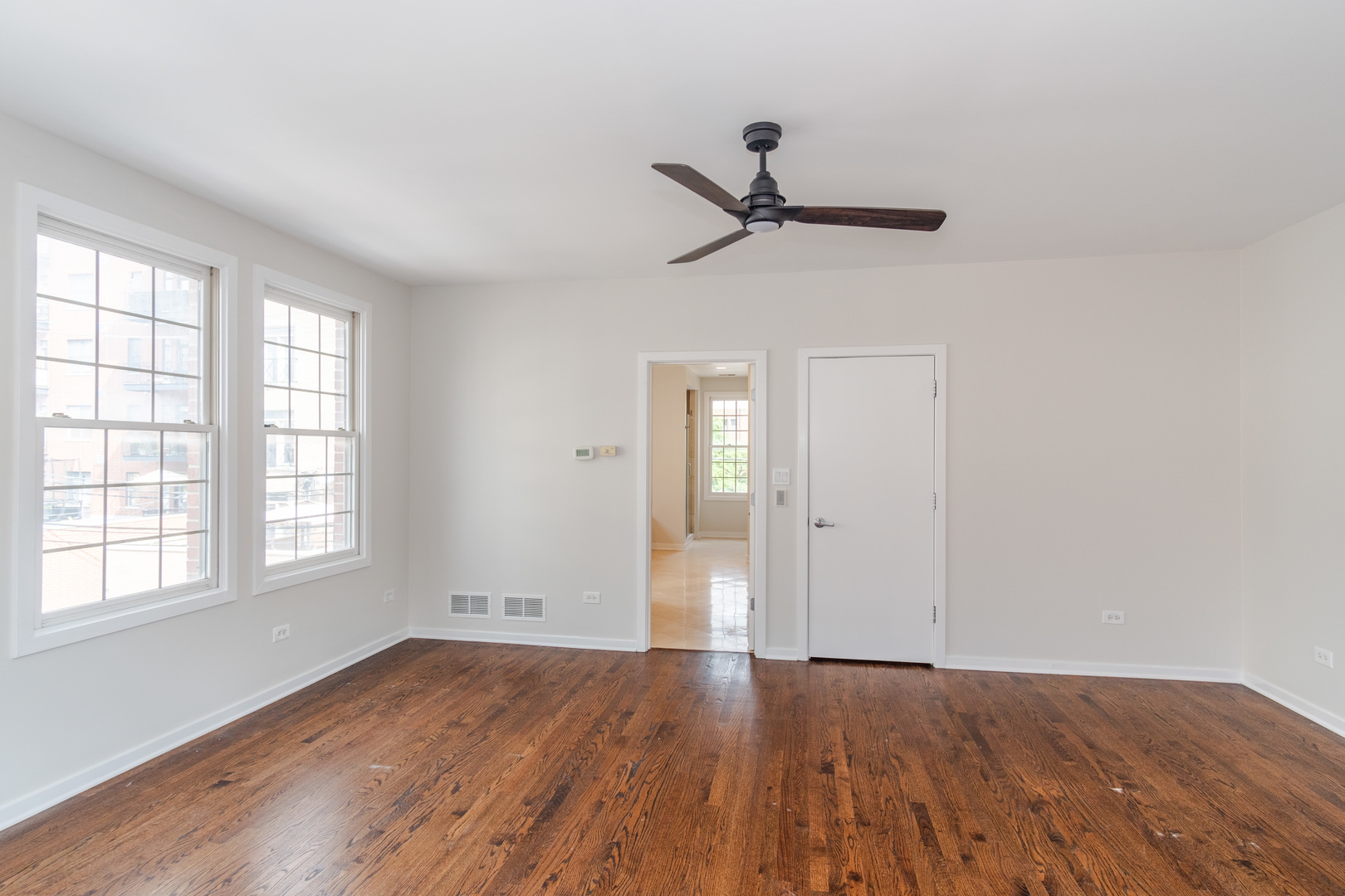 24 North Ada Street, Unit I Chicago, IL 60607 - Photo 15 of 29 an empty room with wooden floor closet and windows